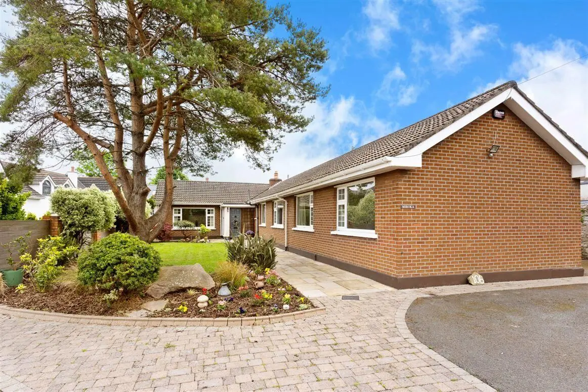Existing single-storey bungalow viewed from its landscaped entrance