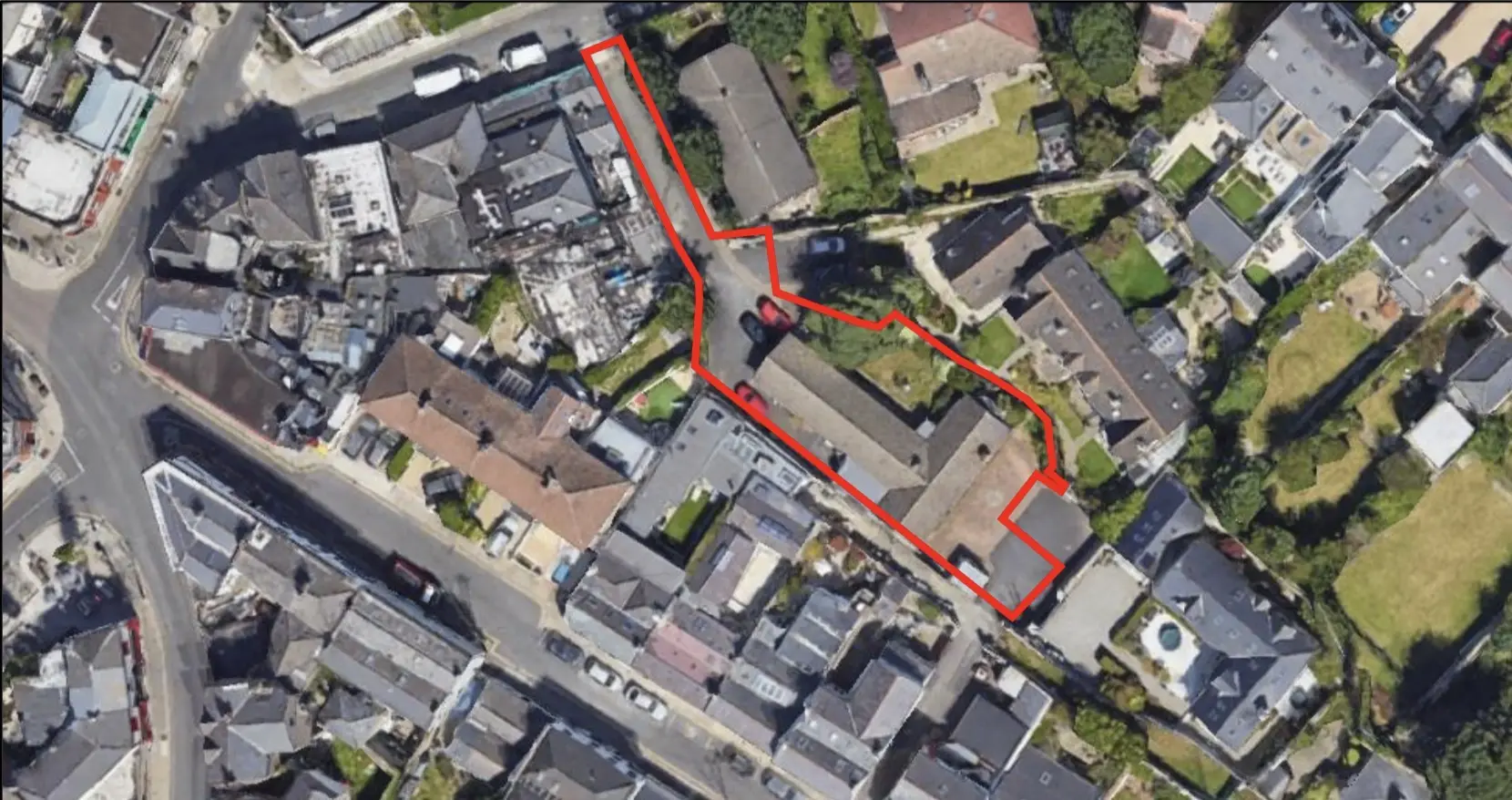 Aerial view of 106 Coliemore Road with the site boundary outlined in red